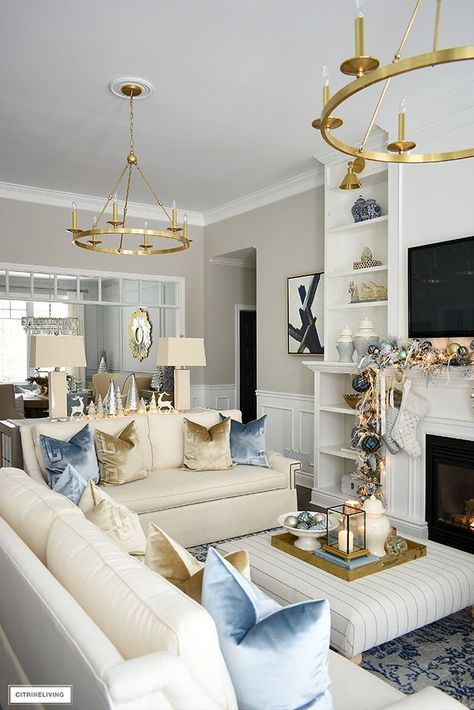 ELEGANT CHRISTMAS LIVING ROOM: SOFT BLUE, GOLD, SILVER + WHITE | CITRINELIVING | Bloglovin’ Glam Lounge Room, French Quarter Living Room, Two Light Fixtures In Living Room, Light Blue Decor Living Room, Blue Gray White Gold Living Room, Light Blue And Gold Bedroom Decor, White Gold Decor Living Room, Light Blue Furniture Living Room, Light Blue And Navy Living Room