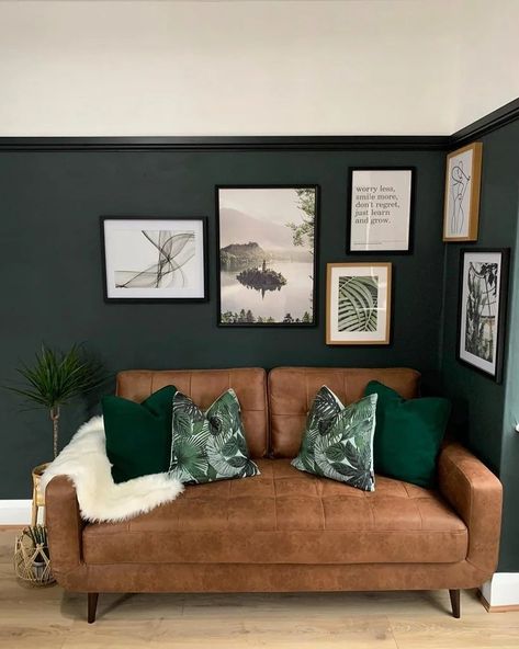 Dark green walls (Studio Green - Farrow and Ball) with a small gallery wall and tan leather sofa in the living room Dark Green Living Room Tan Sofa, Brown Sofa Green Cushions, Green Walls Tan Sofa, Green Living Room Brown Leather Sofa, Olive Feature Wall Living Room, Tan Leather Sofa Green Walls, Wood And Leather Living Room, Green Living Room With Brown Couch, Green Couch Dark Walls