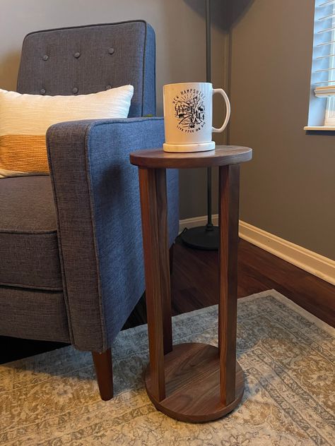 "The Mini Martha Table is a smaller version of our popular Martha table, designed to fit in between two chairs. It's great for holding your drink or other items, and even makes an excellent side table near your favorite reading chair. The small size also makes this table perfect for a drink table! It can hold two cups of coffee and works perfectly between two chairs or next to a sofa. WHY YOU'LL LOVE IT A nod to a classic shape, it's built to be simple, sturdy, and functional. It works well as a Small Side Table In Living Room, Diy Drink Table, Sofa Side Table Decor, Small Side Table Ideas, Tiny Side Table, Simple Small Table, Small Wood Table, Modern Side Table Design, Mini Side Table