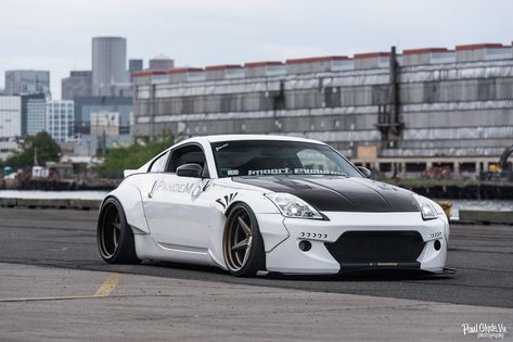Out Of This World White Nissan 350Z Boasting Rocket Bunny Body Kit — CARiD.com Gallery White Nissan, Nissan Z Cars, Rocket Bunny, Stanced Cars, R35 Gtr, Best Jdm Cars, Nissan Z, Nissan Cars, Street Racing Cars