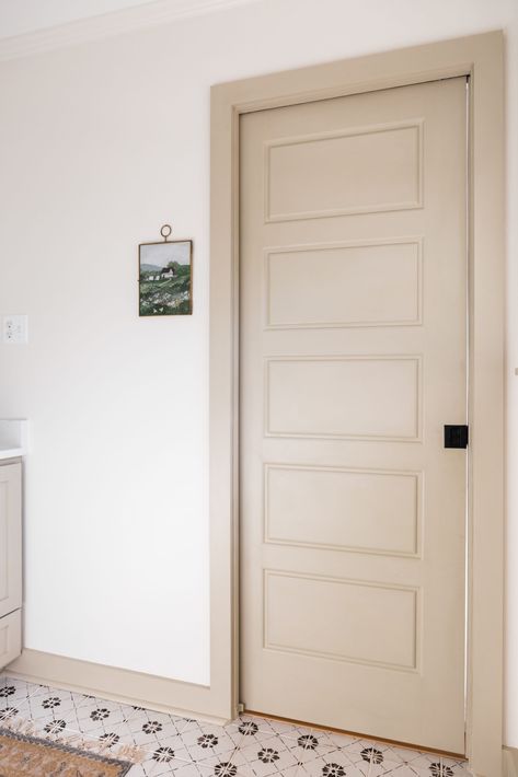 Colored Interior Door Frames, Beige Hallway Doors, Interior Colonial Doors, Colored Door Frames, Taupe Doors And Trim Interior, White Wall Beige Door, Pocket Door To Bathroom, Two Tone Doors And Trim, Hallway With Painted Doors