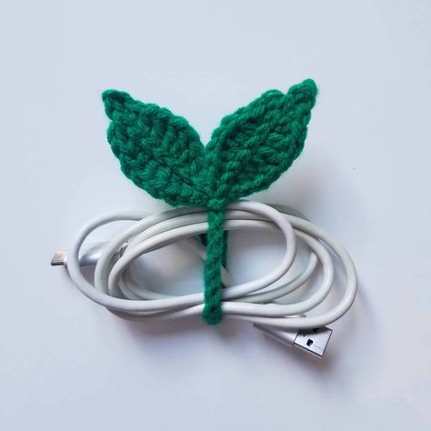 These cute little crocheted leaf sprouts make for some great cable ties or bookmarks. Now that it's back to school season let's start off on the right foot and get ourselves organized! #freecrochetpattern #onceuponacheerio #crochet #crochetpattern #freepattern Amigurumi Patterns, Couture, Crochet Leaf, Bookmark Pattern, Crochet Leaf Patterns, Crochet Cable, Crochet Decrease, Crochet Leaves, Cable Tie