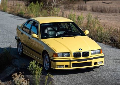 This 1997 BMW M3 is said to be one of only five known 5-speed equipped Dakar Yellow sedans with factory sunroof delete in the US. Mileage is kind of high at 205k, but the seller describes a well cared for car with typical E36 faults such as the coolant system already sorted, adding "there is no Sedans, Coupe, 1997 Bmw M3, E36 Sedan, Bmw 3 E36, Bmw M3 Coupe, M3 Sedan, E36 M3, German Beauty