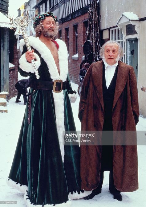 George C. Scott (at right) stars as the penurious, stingy businessman Ebenezer Scrooge, and Edward Woodward (at left) is the Ghost of Christmas Present, in A Christmas Carol, Charles Dickens classic holiday tale. Originally broadcast on CBS on Monday, December 17, 1984. Image dated April 1, 1984. Christmas Carol Ghost Of Christmas Past, Christmas Present Costume, A Christmas Carol Themes, Steampunk Santa, Christmas Carol Ghosts, The Ghost Of Christmas Present, Edward Woodward, Dickens Dress, Ghost Movie