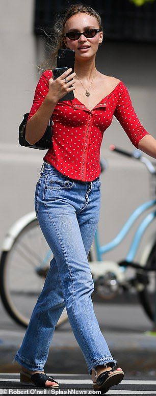 On a call: The actress took a phone call while wearing a low-cut red blouse, blue jeans an... Lily Rose Depp Street Style, Lily Rose Depp Outfits, Blouse And Jeans, Lily Rose Depp Style, Rose Outfits, Brittany Murphy, Famous Outfits, Streets Of New York, Emma Chamberlain