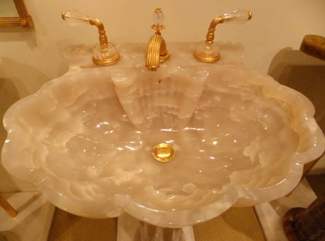 Sherle Wagner sink and fixtures post:  http://courtneyprice.com/sherle-wagner-yes-please/ Bathroom Trolley, Bathroom Furniture Ideas, Shell Sink, Carved Sink, Sherle Wagner, Quartz Bathroom, Quartz Sink, Gold Faucet, Vanity Bathroom