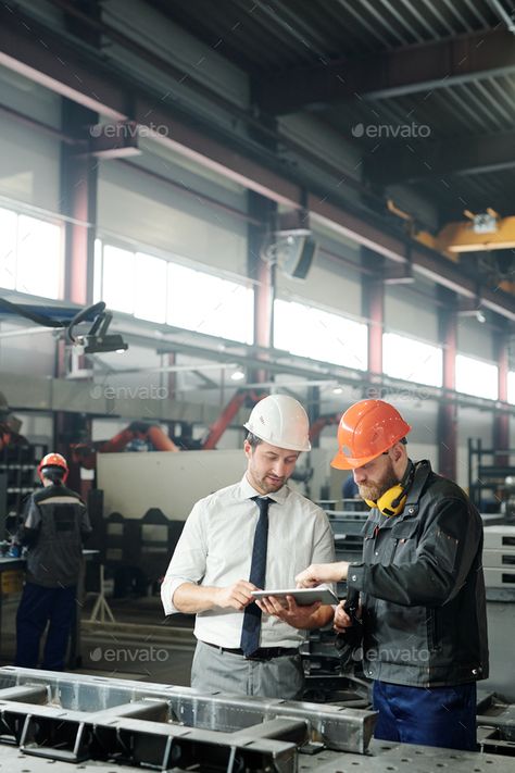 Engineering industrial machine by Pressmaster. Technician in formalwear using tablet while engineering industrial machine with factory worker in workshop #Sponsored #Pressmaster, #Technician, #machine, #Engineering Nantes, Industrial Engineering Aesthetic, Engineering Photos, Engineering Industrial, Factory Photography, Job Pictures, Virtual Families, Factory Worker, Engineering Companies