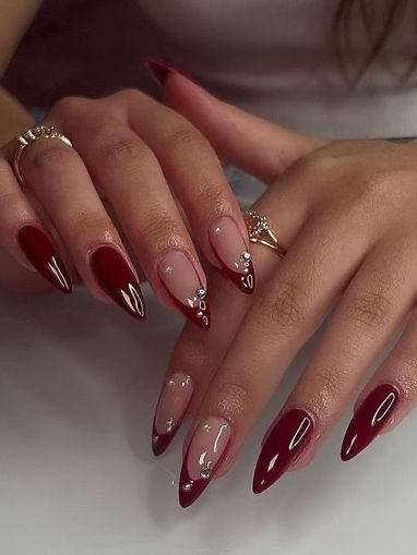 red French tip nails: burgundy with a gem accent Red Thanksgiving Nails, Xmas Nails Almond, Square Nails 2023, Almond Nails 2023, Rhinestone Nail Ideas, Almond Red Nails, Cherry Wine Nails, Black Cherry Nails, Black Prom Nails