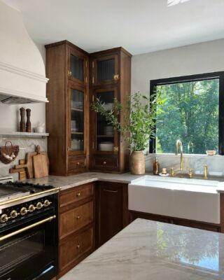 Dark Wood Floor Light Wood Cabinets, Kitchen With Wood Floors And Cabinets, Matte Black And Wood Kitchen, Light Grey And Walnut Kitchen, Brown Bottom Cabinets White Top, Modern Natural Kitchen Design, Apartment Inspo Dark Wood, Modern Kitchen With Gold Hardware, Walnut Master Bath