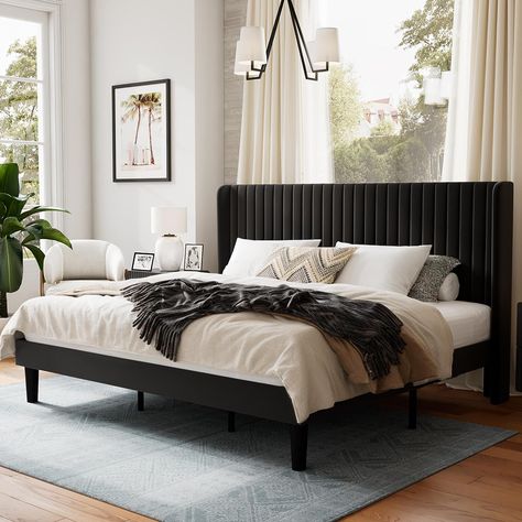 The bed frame is beautifully upholstered in soft velvet and features a wingback headboard design, adding a stylish touch of glamour to any home decor. Black Queen Bed Frame, Black Queen Bed, Tufted Wingback Headboard, Velvet Bed Frame, Black Bed Frame, Lit King Size, Support Beams, King Size Bed Frame, Black Bedroom