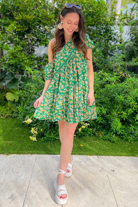 Get ready to spread your wings and embrace your fun and trendy style with the Spread Your Wings Asymmetrical Green Floral Puff Sleeve Mini Dress. This mini dress features a vibrant green and yellow floral pattern that is sure to catch everyone's attention. The tiered design adds a playful and flirty touch, while the asymmetrical neckline adds an edgy and unique detail. The puff sleeves give it a feminine and whimsical vibe, while the babydoll fit ensures a comfortable and flattering silhouette. Features: Green and yellow floral pattern for a vibrant and eye-catching look Tiered design adds a playful and flirty touch Asymmetrical one shoulder neckline for an edgy and unique detail Puff sleeves add a feminine and whimsical vibe Babydoll fit ensures a comfortable and flattering silhouette Puff Sleeve Mini Dress, Asymmetrical Neckline, Vibrant Green, Trendy Style, Mini Dress With Sleeves, Yellow Floral, Puff Sleeves, Puff Sleeve, Trendy Fashion