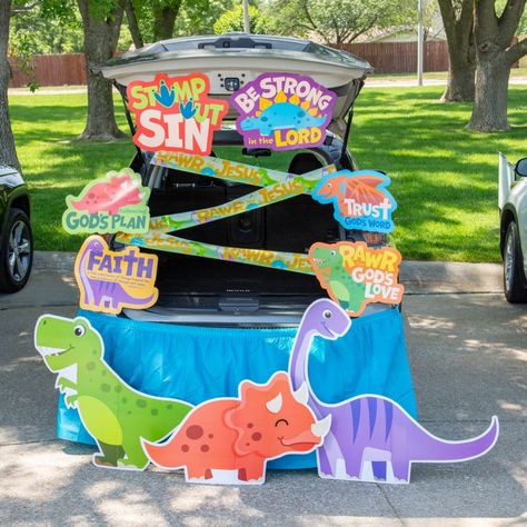 Stomp your way into Halloween fun with these smiling dinosaurs! This convenient kit provided the essentials to dress up your vehicle for a church community trunk-or-treat event. Be sure to browse our site for some roar-some candy favorites to give to all the trick-or-treaters. (11 pcs. per unit) Simple assembly required.Includes:o 3 Cardboard Dinosaur VBS Bright Stand-Ups (37 1/4" - 41" x 23" - 35 1/2" Simple assembly required. Stand-ups are one-sided with a brown cardboard back.)o 1 Plastic Dinosaur VBS Caution Tape (20 ft. x 4 1/2")o 6 Cardstock Dinosaur VBS Cutouts (18" - 20 1/2" x 13" - 16")o 1 Plastic Turquoise Pleated Table Skirt (14 ft. x 29")o Assortments are subject to change at any time and may vary from picture shown. Substituted items will be similar in nature. Dinosaur Trunk Or Treat, Dinosaur Vbs, Cardboard Dinosaur, Plastic Dinosaur, Trunk Or Treat Ideas, Plastic Dinosaurs, Church Community, Caution Tape, Treat Ideas