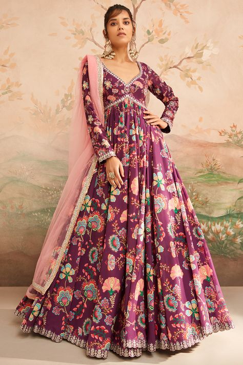 Featuring a wine anarkali in georgette base with floral print, including handwork, thread, stone and zari embroidery. It is paired with shantoon pants and a net dupatta. Style this designer anarkali set with ethnic dangler earrings and heels for weddings or festive occasions.#Perniaspopupshop #womenswear #ethnic #whatiworewastrending #ppuslove #anarkali #Georgette #Shantoon #weddingwear #festivewear Net Anarkali Dresses, Anarkali Georgette, Ridhi Mehra, Dupatta Style, Anarkali Dresses, Georgette Anarkali, Embroidered Anarkali, Zari Embroidery, Dangler Earrings