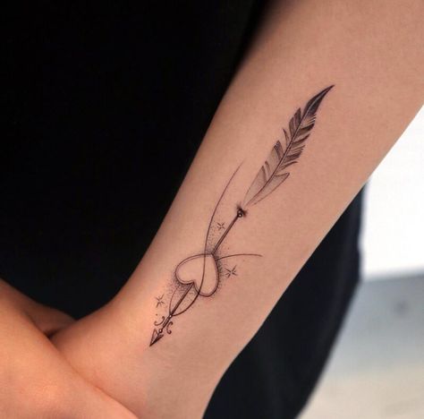 Arrow and feather tattoo located on the wrist Forearm Arrow Tattoo, Small Feather Tattoo, Feather Tattoo Wrist, Rebirth Tattoo, Empowering Tattoos, Arrow Tattoos For Women, Tiny Wrist Tattoos, Sagittarius Tattoo, Small Forearm Tattoos