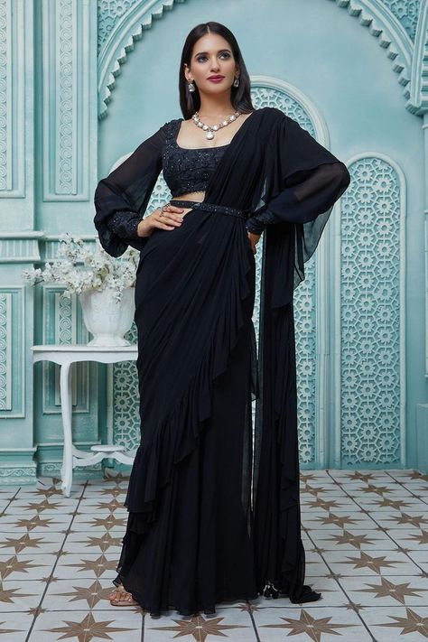 Buy #black #draped #saree with #ruffle borders. Paired with #floral #embroidered puff #sleeve #blouse & embroidered belt by #AriyanaCouture at #AzaFashions Shop online now at #Azafashions.com Call +91 8291990059 or email contactus@azafashions.com for enquiries. #wedding #festive #ethnic #tradional #shopping #shoponline #party #reception #bride Couture, Black Floral Saree, Saree Styles For Farewell, Black Saree Designs, Full Sleeves Blouse Designs, Black Saree Blouse, Black Blouse Designs, Saree With Belt, Simple Saree Designs