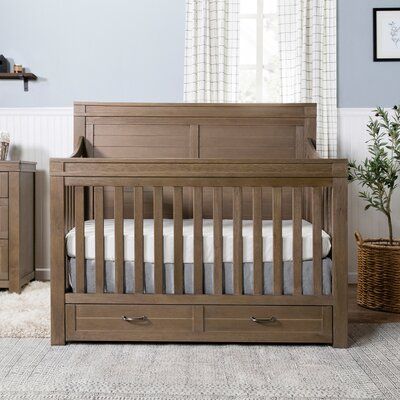 Reminiscent of the idyllic countryside, the Wesley farmhouse 4-in-1 convertible crib takes inspiration from the classic, farmhouse style. With the addition of an under-drawer, the Wesley crib provides ample space for your baby’s necessities, while its rustic shiplap design combines with graceful curves to create a cozy place for your baby to sleep. Color: Stablewood | Namesake Wesley Farmhouse 4-in-1 Convertible Crib Wood in Brown | 49 H x 30 W in | Wayfair Rustic Nursery Furniture, Crib With Storage, Crib Diy, Farmhouse Cribs, Idyllic Countryside, Rustic Shiplap, Brown Crib, Brown Nursery, Baby Crib Diy