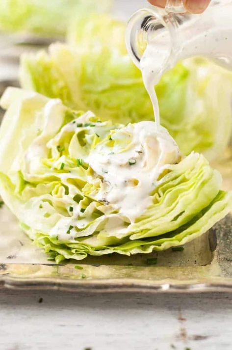 Pouring Ranch Dressing on Lettuce Wedges for Lettuce Wedge Salad Lettuce Wedge Salad, Salad With Ranch Dressing, Iceberg Lettuce Salad, Iceberg Wedge Salad, Salad With Ranch, Lettuce Wedge, Chop Salad, Mixed Veggies, Hcg Recipes