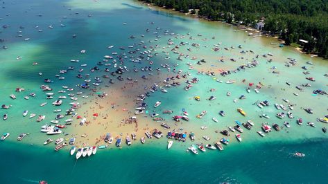 Colorful boats are anchored around the famous Torch Lake sandbar Torch Lake Michigan Things To Do, Sandbar Party, Torch Lake Michigan, Usa Vacations, Mackinaw Island, Boat Days, Travel Michigan, Beach Clouds, Michigan Adventures