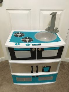 DIY play-kitchen with duck tape and plastic drawers. The Eighth Daughter Play Oven Diy, Diy Cardboard Play Kitchen, Diy Play Kitchen For Older Kids, Diy Toy Grill, Diy Kitchen Play Set Kids, Play Stove Top Diy, Diy Play Kitchen Cardboard, Diy Kids Kitchen Ideas, Diy Play Kitchen Accessories