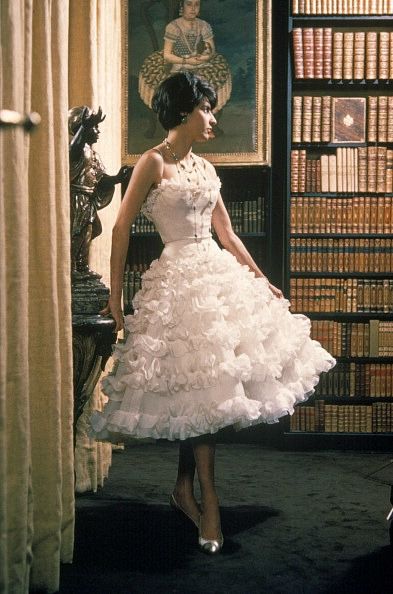 Model is wearing a frothy, tiered party dress by Chanel, 1960 Chanel 2020, 1960 Dress, Look Formal, Mode Chanel, Fashion 1960s, Chanel Dress, Festa Party, Vintage Fashion Photography, Vintage Couture