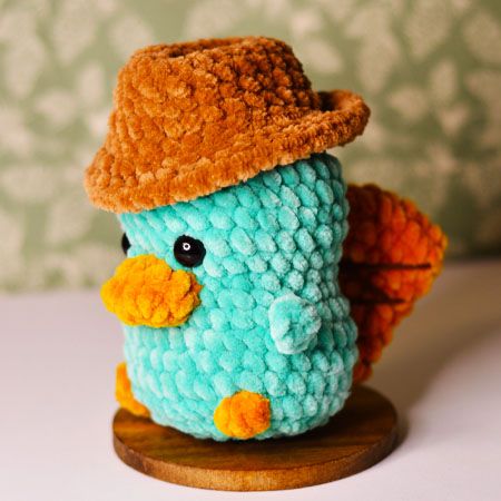 Platypus with Hat Free Amigurumi Crochet Pattern Amigurumi Patterns, Crochet Patterns Platypus, Crochet Hat For Toys, Free Perry The Platypus Crochet Pattern, Crochet Platypus Pattern, Perry Platypus Crochet, Cute Crochet Plushies Ideas, Plushies Crochet Pattern Free, Perry The Platypus Crochet Pattern Free