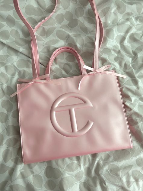 Ballerina pink telfar with bows tied to the handle of the telfar bag. This is Telfars latest pink bag release Pink Telfar Bag Medium, Ballerina Pink Telfar, Ballerina Telfar Bag, Tel Far Bag, Pink Dior Bag, Telfar Medium Bag, Pink Telfar, Telfar Bag, Uni Bag