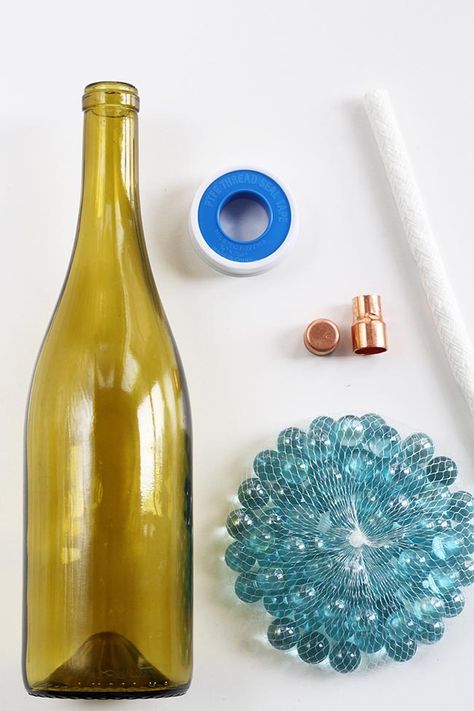 DIY: Wine Bottle Citronella Candles | http://helloglow.co/diy-wine-bottle-citronella-candles/ Wine Bottle Citronella Candles, Bottle Torch, Wine Bottle Tiki, Wine Bottle Tiki Torch, Diy Wine Bottle, Wine Bottle Project, Hello Glow, Wine Bottle Corks, Homemade Wine