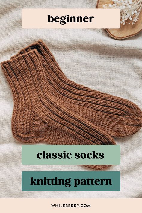 If you've always wanted to knit basic cozy socks, use this minimalist knitting pattern to knit your first simple sock pair! Using worsted weight yarn, they are super quick to knit and will be a great choice for gift knitting too. Find this beginner sock knitting pattern at whileberry.com Ribbed Socks Knitting Pattern, Basic Sock Pattern, Knit Sock Pattern Free Beginner, Free Sock Knitting Pattern, How To Knit Socks For Beginners, Easy Beginner Knitting Projects, Beginner Sock Knitting Pattern, Knitting Patterns Beginner, Boot Socks Knitting Pattern