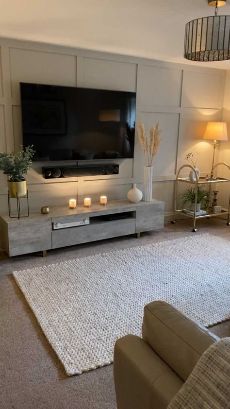 placeshaperinteriors on Instagram: Getting cosy in the Snug room for autumn 🍂. . . #snugroom #tvroom #neutraldecor #pannelling #concretetvunit #yellowchair #classyinteriors… On Trend Living Room Decor, Neutral Colors Living Room Decor, Living Room Decor Ideas Neutral, Living Room In Basement Ideas, Uk Living Room Ideas Interior Design, Cosy Front Room, Home Decor Ideas Apartment Living Room, Minimal Cosy Living Room, Grey Loving Room