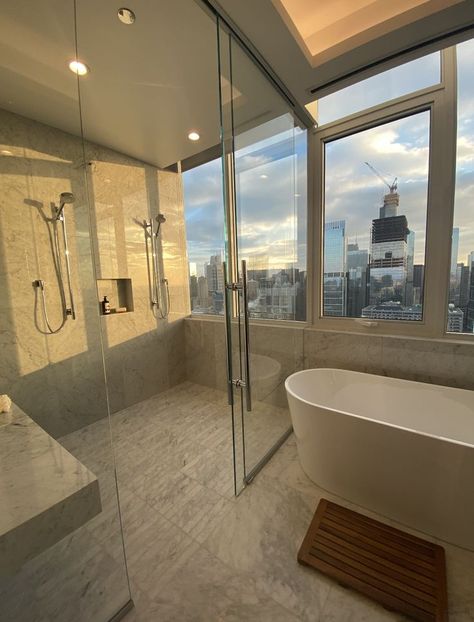 Perfect does not even begin to describe this bathroom! Throwback to our tour at one of the most beautiful penthouses in Chicago! 

Locate a luxury apartment with AptAmigo, a team of professional apartment locators. Enjoy natural light with floor-to-ceiling windows. AptAmigo has the ultimate list of the best luxury apartments with floor-to-ceiling windows in Chicago. Apartment With Nice View, Nyc Apartments Luxury, Apartment With Glass Wall, Rich Penthouse Apartment, Glass Appartments, Ew York Apartment, Dream Apartment Aesthetic Bathroom, Nyc Luxury Apartment Bedroom, Nyc Penthouse Interior