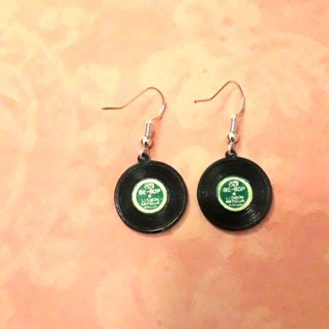 Unique Record Earrings, Vintage Record Charms On Sterling Silver Hooks. Mini Record Charms From The 1960's With Names Of Songs On The Label! Black Record With Emerald Green Label, About The Size Of A Dime. Great For Bands, Musicians, Party Favor, Dancers, Ice Skaters, Record Lovers, Guitar Players, Drummers, Concerts. Keyword Tags: Retro, Vinal, Records, Music, Charms, Boho, Goth, Jazz, Jam, Band Record Earrings, Grunge Earrings, Boho Beach Style, Wire Jewelry Rings, Lavender Earrings, Goth Earrings, Music Jewelry, Floral Studs, Funky Earrings
