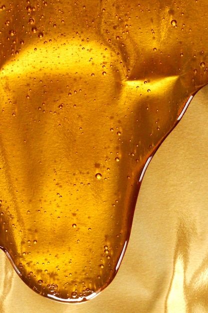 Drip honey with bubbles on a golden back... | Premium Photo #Freepik #photo #honey-dripping #honey #syrup #honey-background Yellow Moodboard, Fresh Honeycomb, Honey Art, Yellow Aesthetic Pastel, Exposition Photo, Golden Background, Seni 3d, Gold Aesthetic, Natural Honey