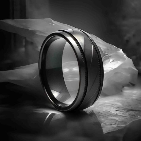 Men's Black Zirconium Wedding Ring You're not your parents so why should you purchase a wedding ring designed to fit them? Our selection of zirconium rings ranges from the elegant to the fun and trendy, and includes things like this classic black wedding ring that's brushed with diagonal milled grooves. The polished shiny bevels on the sides give this beautiful piece its unique flair, perfect for both men and women who are looking for more in a ring.This modern men's wedding band is available in Wedding Ring, Classic Black Wedding, Black Wedding Ring, Men's Wedding Band, Ring Black, Unique Fonts, Men's Ring, Black Wedding, Classic Black