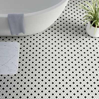 Transform your space into a tribute to retro design with our Metro Hex Matte White with Black Dot 10-1/4 in. x 11-7/8 in. Porcelain Mosaic Floor and Wall Tile. As a modern deviation from the classic hexagon mosaic, this tile option is a throwback to traditional retro design with a contemporary feel. Matte white hexagons are accented by contrasting black chips and precisely arranged on an interlocking mesh to create a seamless installation. This minimalistic geometric porcelain mosaic is unique y Penny Tiles Bathroom, Penny Tile, Black And White Tiles, Merola Tile, Hexagonal Mosaic, Porcelain Mosaic Tile, Mosaic Flooring, Bathroom Floor Tiles, Porcelain Mosaic