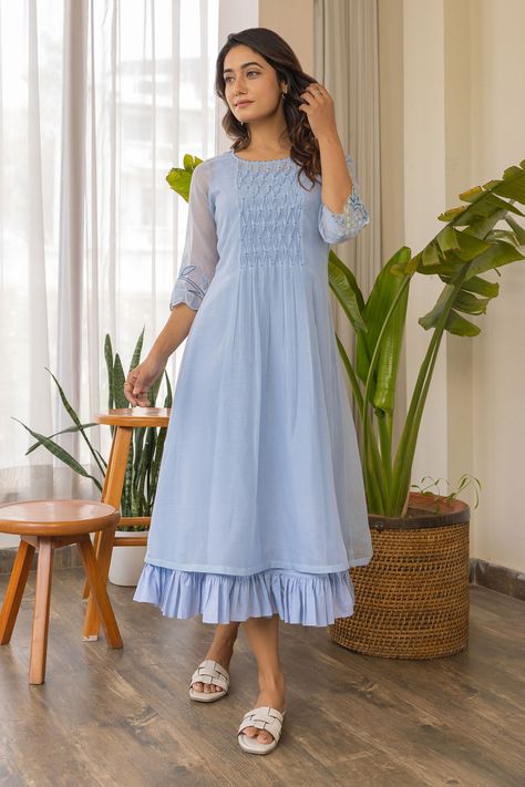 Sky blue chanderi kurta with thread hand embroidered sleeves, smocked centre and pearl detailing. Comes with a cotton frilled inner. Components: 2 Pattern: Hand embroidered Type Of Work: Thread Neckline: Round Sleeve Type: Kurta : Three quarter, Inner : Sleeveless Fabric: Kurta : Chanderi, Inner : Cotton Color: Blue Other Details:  Frilled hem on inner Occasion: Work - Aza Fashions Long Frocks For Women, डिजाइनर कपड़े, Indian Dresses For Women, Simple Frock Design, Women Dresses Casual Summer, Frocks And Gowns, Simple Frocks, Chiffon Frocks, Chanderi Kurta