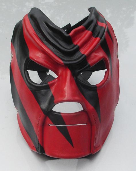 Kane's mask from WWE Kane Wrestler, Kane Mask, Villain Mask, Wwe Mask, Kane Wwe, Ghost Face Mask, Comic Con Costumes, Wwe Royal Rumble, Martial Arts Boxing