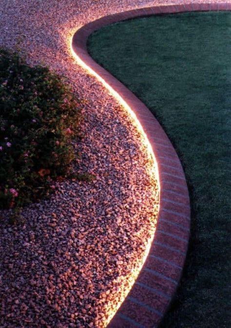 Use rope light to line walkway or edging. Not only is this great to create an illuminating ambience that will make your backyard glow, but it is also great for safety at night! Under Fence Edging, Glow In The Dark Backyard Ideas, Front Yard With Driveway, Dry River Bed Landscape Yard Ideas, Front Entrance Landscaping, Backyard Landscaping Flowers, Lighting Your Garden, Diy Outdoor Lighting, Desain Lanskap
