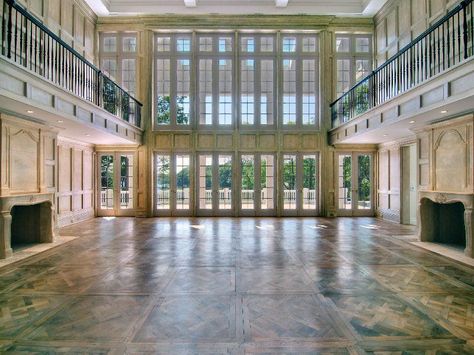 The great room in a $35 million dollar home features dueling fireplaces, French chalked wood... Hamptons Mansion, White Mansion, Hampton Estates, Marble Tub, Mansion Floor Plan, Open Living, Historic Mansion, Open Living Room, Guest Cottage