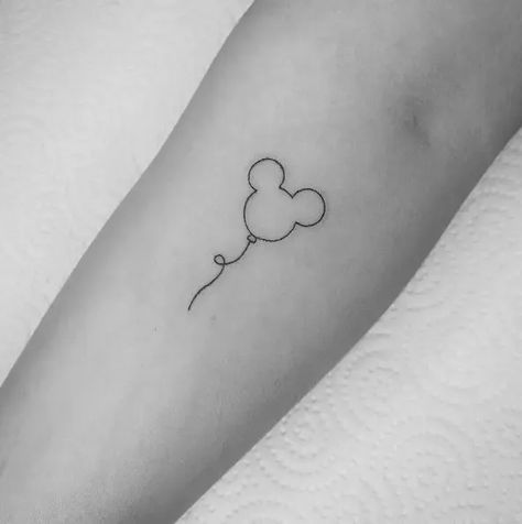 Explore these charming Disney tattoo ideas that will transport you back to the enchantment of your childhood ✨💫 Capture the magic with character-inspired designs like Mickey, Cinderella, Elsa, and more! #Disney #TattooIdeas #ChildhoodMemories Matching Mickey Tattoos, Disney Matching Tattoos Mom, Disney Tattoos Sisters, Keep Moving Forward Tattoo Disney, Disney Simple Tattoo Ideas, Small Disney Wrist Tattoos, Minimalist Mickey Tattoo, Disney Park Tattoo Ideas, Finger Tattoos Disney