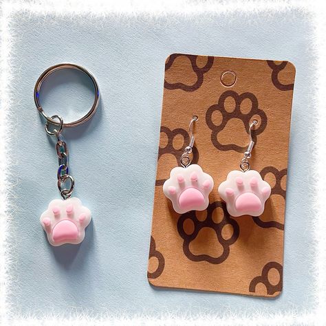 Cute cats paws on silver earrings  (These earring hooks are nickel-free with anti-allergy that is safe for sensitive skin.) Or A single cats paw on a silver keyring, great for accessorising! Cats paw measuring roughly 2cm in height.  DELIVERS FROM UK - Can take 2-4 weeks to be delivered worldwide! Paw Keychain, Cats Paw, Clay Cat, Clay Keychain, Clay Cats, Cat's Paw, Cat Paw Print, Cat Paw, Cute Clay