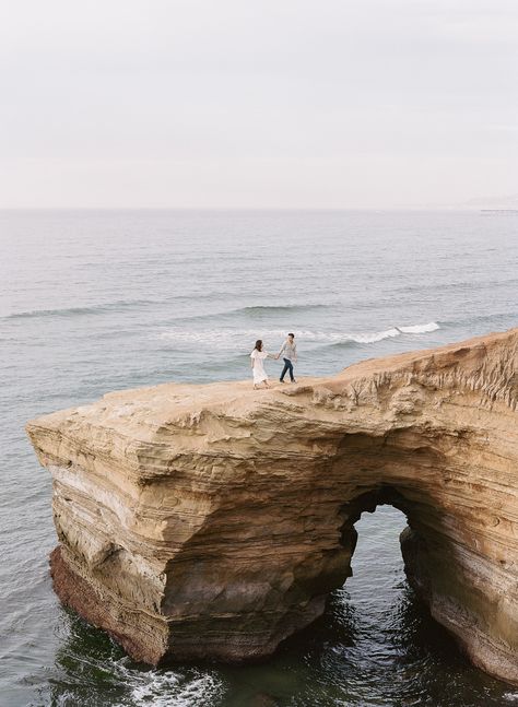 Sunset Cliffs Engagement Photos in San Diego Fine Art Engagement Photos #engaged #sandiegoengagement #sunsetcliffs Porto, Engagement Photo San Diego, Cliffs Engagement Photos, Sunset Cliffs San Diego Engagement, Sunset Cliffs San Diego Elopement, Sunset Cliff Engagement Photos, San Diego Beach Engagement Photos, West Coast Engagement Photos, Landscape Engagement Photos