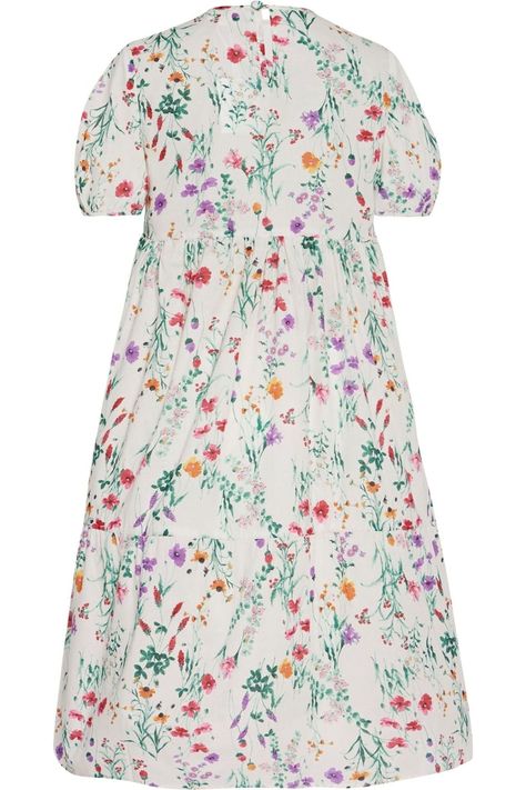 Our popular Madeline dress in lightweight cotton will keep you chic and relaxed even on the hottest days. Featuring pretty puff sleeves and a loose, comfortable fit, the Madeline dress will become your closet go-to. Wear it during the day with sandals or in the evening with heels. Elongating babydoll dress (yes, it's possible!) in a colorful floral print Keyhole closure with covered button along the back neckline 100% cotton Made in New York City Machine wash cold and hang to dry