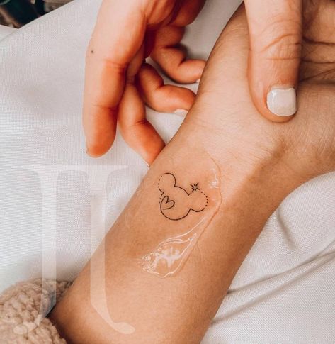 Disney Tattoos Wrist, Ankle Tattoo Disney, Mini Mickey Tattoo, Mickey Mouse Tattoo Minimalist, Small Disneyland Tattoos, Feminine Disney Tattoo, Minnie Mouse Wrist Tattoo, Mickey Mouse Wrist Tattoo, Discrete Disney Tattoos