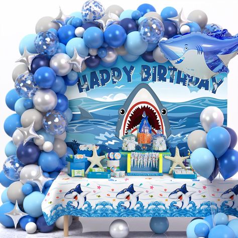 PRICES MAY VARY. 146Pcs Shark Birthday Decorations - If you have a child who loves the ocean and loves sharks, then don't miss this set of shark birthday party decorations. You can get 125 latex balloons (5"+10"+12''), 5 blue confetti balloons, 10 silver star foil balloons, 1 large shark foil balloon, 1 shark backdrop, 1 shark theme tablecloth, 100 dots, 1 roll ribbon (10m), 1 balloon arch strip (5m). The vibrant and stunning shark party decorations will turn your celebration into a marvelous ad Shark Balloon Garland, Ocean Themed Party Decorations, Shark Birthday Party Decorations, Shark Birthday Decorations, Shark Balloons, Balloon Garland Birthday, Ocean Theme Party Decorations, Ocean Themed Party, Sea Birthday Party Decorations