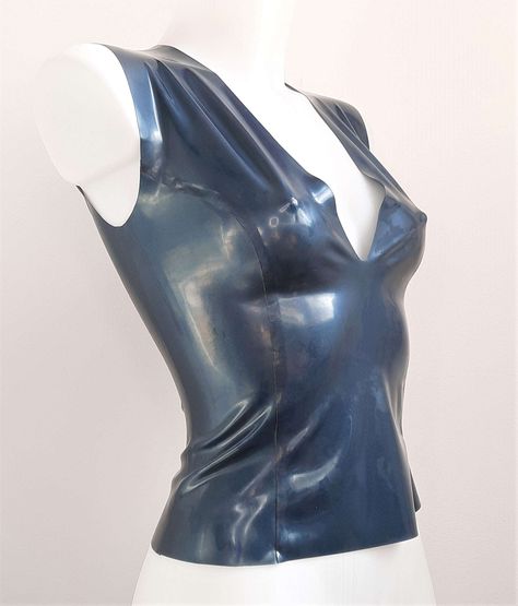 THE perfect latex top for mixing and matching, wear with jeans for a daytime look and then pair with a latex skirt and heels to swap your look to evening wear.Made from medium weight latex, has a deep V front and a high neck back, princess lines for a great fit. Sleeveless and pull on style, no zip or fastener. Also available in other colours, just pop me a message to see what I have in stockSizes XS to XL available, please check the size chart for measurements.This is made to order so please allow 2-3 weeks Latex Top, Latex Skirt, Mauve Purple, V Neck Top, Evening Wear, Deep V, High Neck