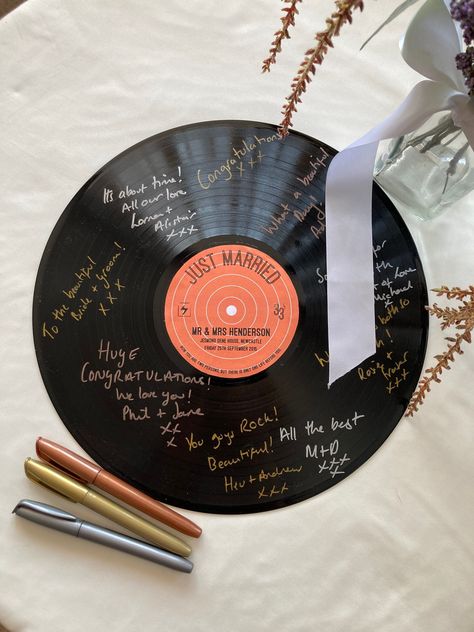 Custom Record Label & Vinyl Record Guest Book

A unique and stylish way to collect guest signatures at your wedding or event. #weddingguestbook #vinylrecordguestbook . #Vinyl_Record_Backdrop #Album_Release_Party_Ideas #Vinyl_Record_Guest_Book #Record_Guest_Book Vinyl Record Photo Backdrop, Vinyl Record Backdrop, Vinyl Wedding Ideas, Disco Party Ideas Decoration, Vinyl Record Guest Book, Record Guest Book, Painting Records, Vinyl Records Decor, Vinyl Record Wedding