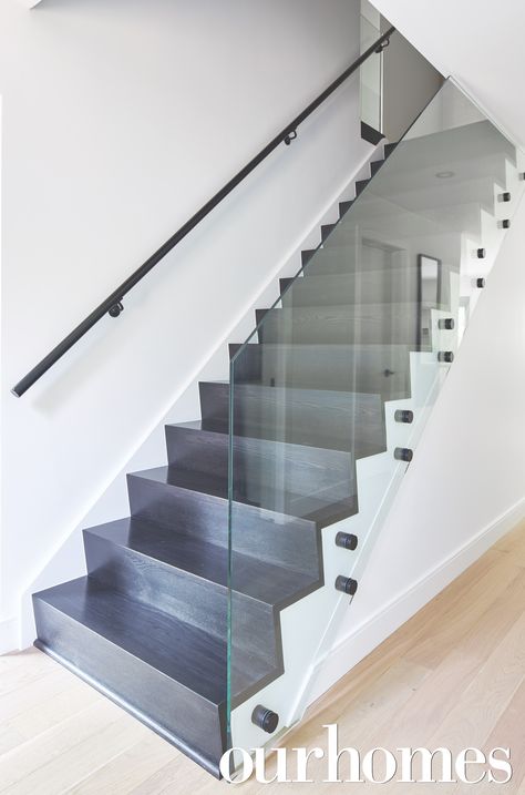 Modern glass and grey gray stairs give this home a contemporary look. Stair Panels, Glass Stair Balustrade, Stair Balustrade, Stairs Tiles Design, Modern Staircase Railing, Glass Staircase Railing, Glass Stair, Glass Railing Stairs, Glass Handrail