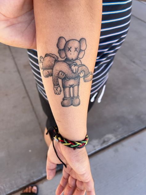 Small Kaws Tattoo, Kaws Doll Tattoo, Hype Beast Tattoo, Kaws Tattoo Ideas For Women, Kaws Leg Tattoo, Kaws Tattoo Stencil, Kaws Tattoo Ideas For Men, Bape Tatoos, Kaws Tattoo Design