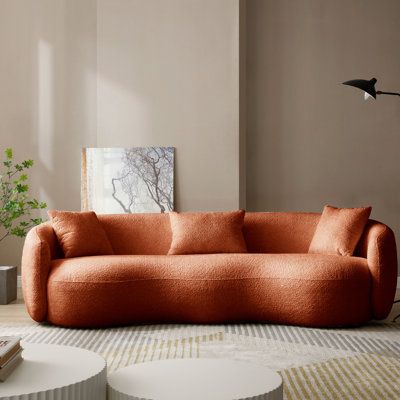 The 93.6" Upholstered Sofa makes it the perfect addition to any living space looking to add a bit of a traditional flair. Upholstered with 100%, this clean and simple design is lovely placed in your living room or office. | Everly Quinn Yazgur 93.6" Upholstered Sofa Orange 26.9 x 93.6 x 41.3 in | C004646294_19943760 | Wayfair Canada Curved Sofa Brown, Boucle Couch, Modern Curved Sofa, Cream Couch, Brown Loveseat, Couches For Small Spaces, Fabric Couch, Couch For Living Room, Mid Century Contemporary