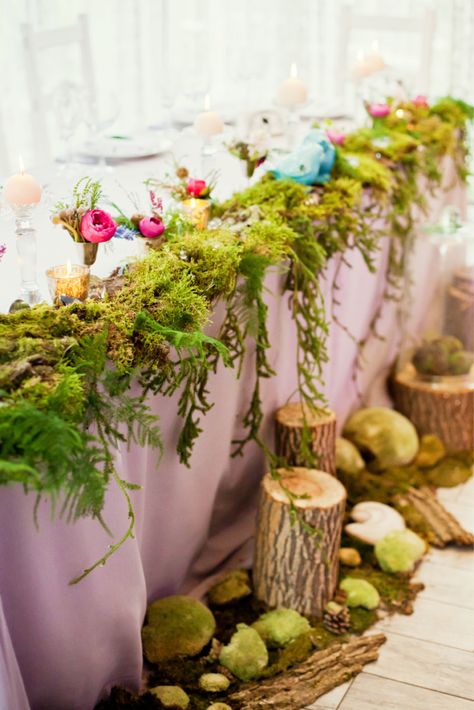 Do you dream of an enchanted forest wedding? A leaf canopy overlooking candle lit tables that stretch down a pathway of calm twilight? Natural looking arbors with glowing orbs of light set the scene for romance when couples exchange vows in an enchanted forest? If you are looking for forest wedding ideas, you’ve come to the right place. Look at some of these unique and beautiful enchanted forest wedding ideas to make your nuptial memories last a lifetime. Enchanted Evening Prom Theme, Enchanted Forest Birthday Party Games, Magical Forest Wedding Theme, Enchanted Forest Bouquet, Enchanted Forest Bridal Shower Ideas, Enchanted Forest Theme Prom, Enchanted Forest Wedding Invitations, Enchanted Forest Theme Party, Candle Lit Table